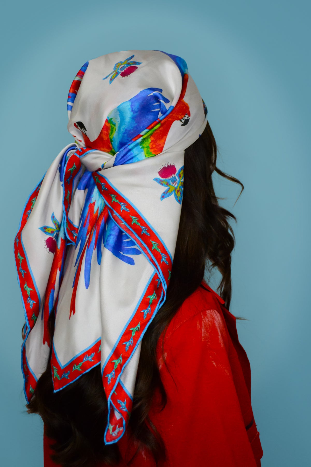 Orquídea silk scarf — hand-illustrated orchid and macaw print on 100% silk twill, worn as neck scarf